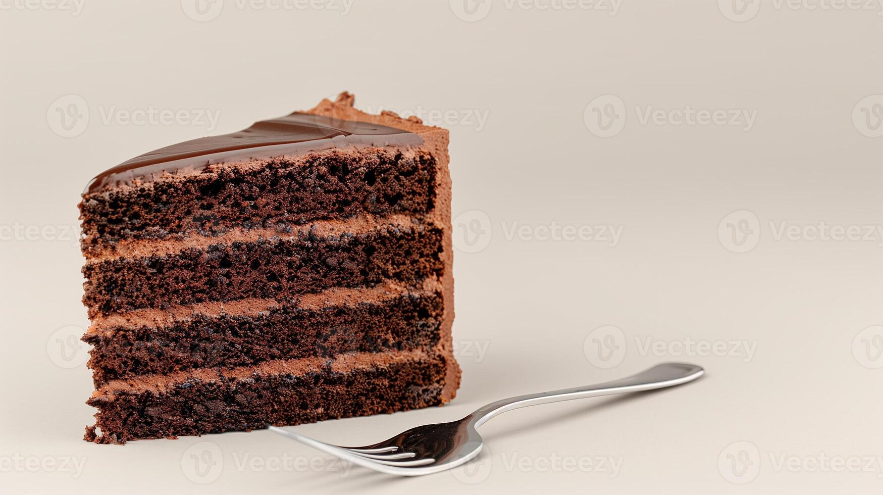 A piece of chocolate cake with a fork photo