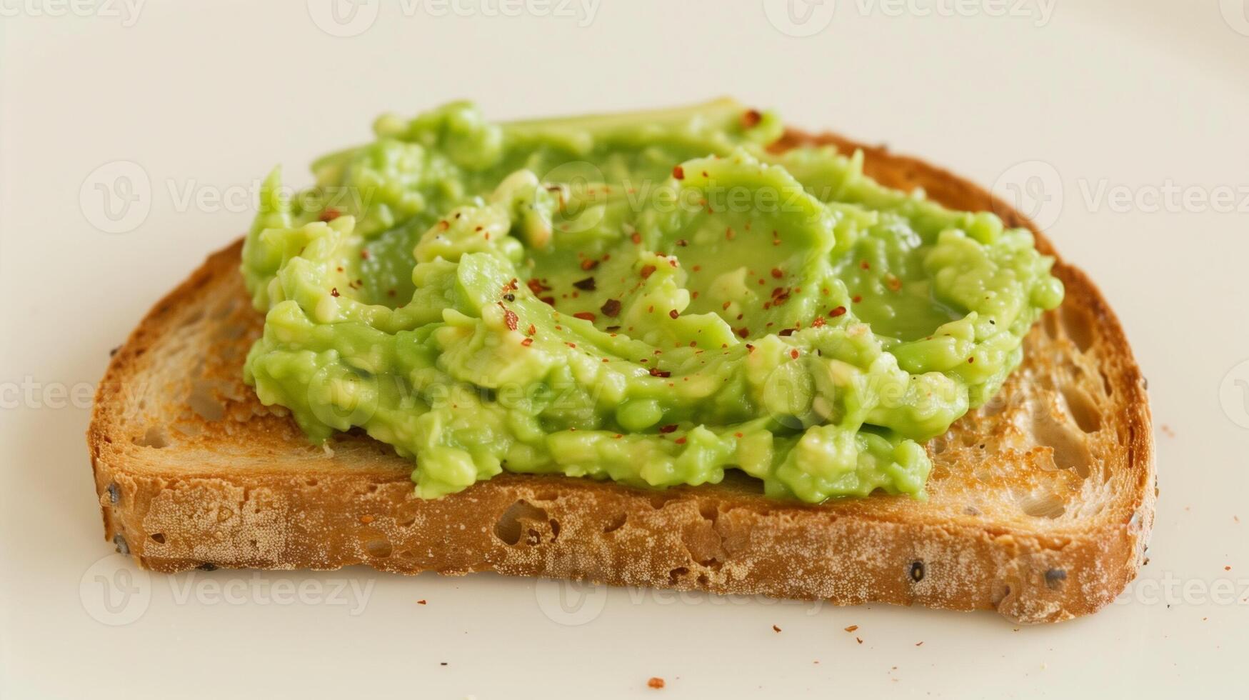 Fresh Toast with Mashed Avocado and Red Pepper Flakes on White Plate, Healthy Snack, Natural Lighting, Close-Up, Organic Ingredients Breakfast or Brunch Homemade Vegan Cuisine Food Photography photo