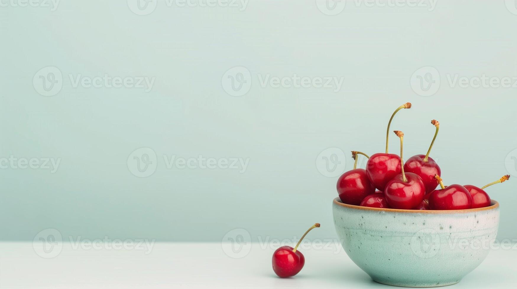 Vibrant Bunch of Fresh Red Cherries in Ceramic Bowl Against Light Blue Background, Minimalist Design, Fresh Fruit Concept, Healthy Eating, Simple Still Life, Harvest Season Treat, Summer Refreshment photo