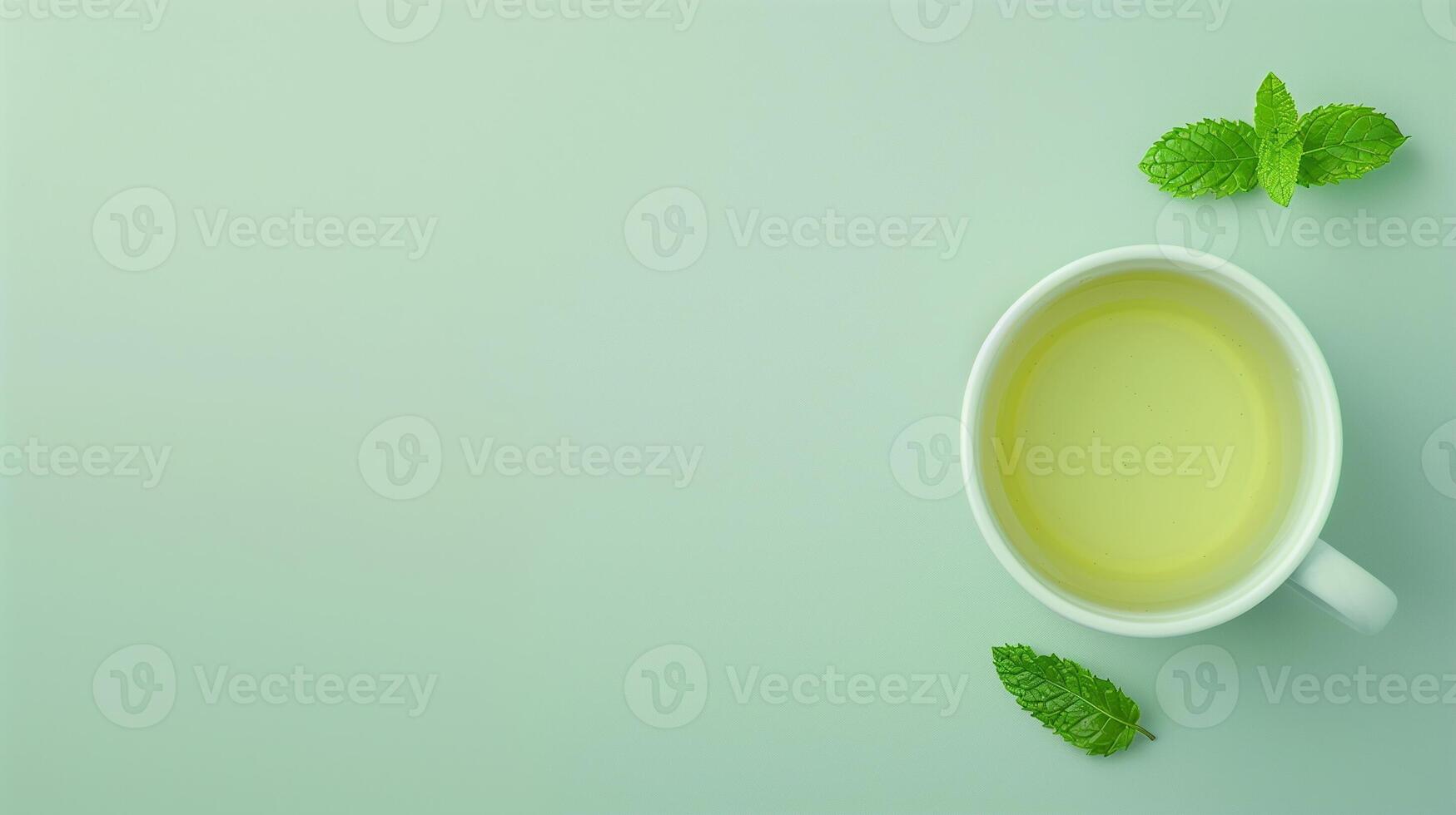 Cup of Green Tea with Mint Leaf on a Light Green Background Perfect for Food and Beverage Themes Wellness Concept Clean Minimalistic Design photo