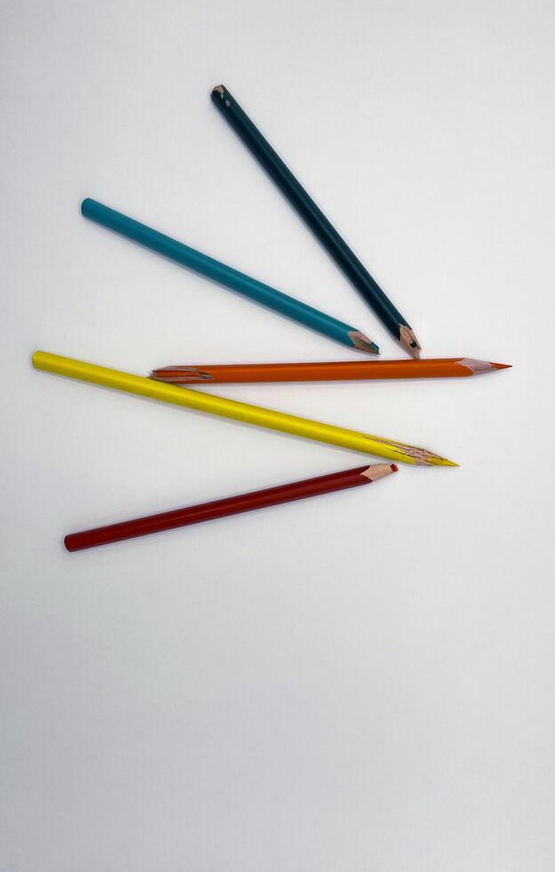 Broken graphite pencil on white background. School stationery photo