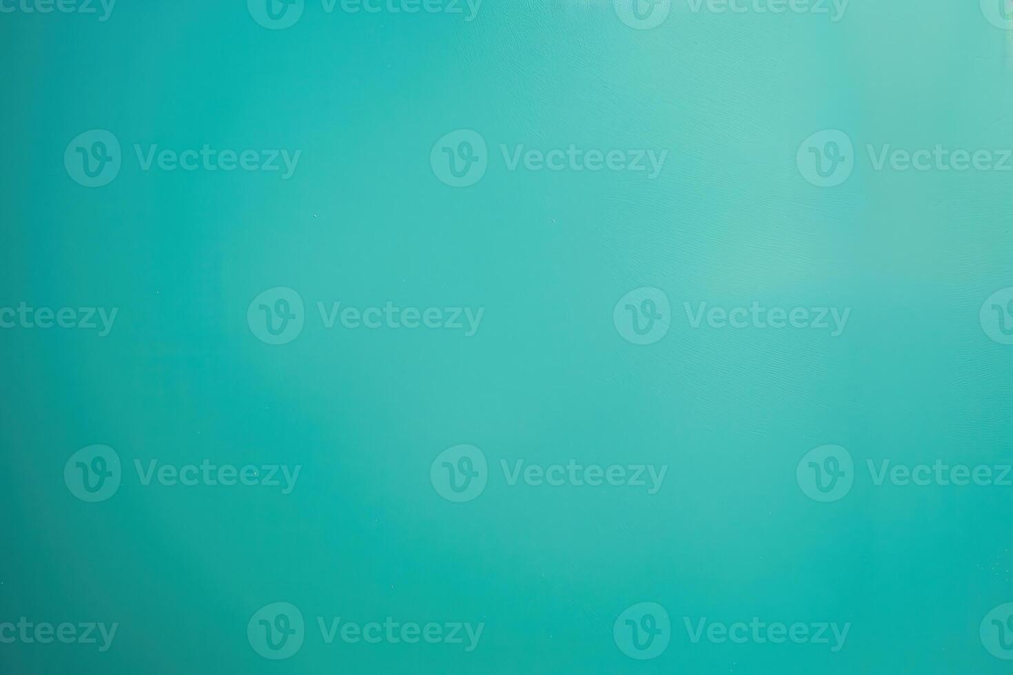Soft turquoise background with slight texture and gradient in natural light photo