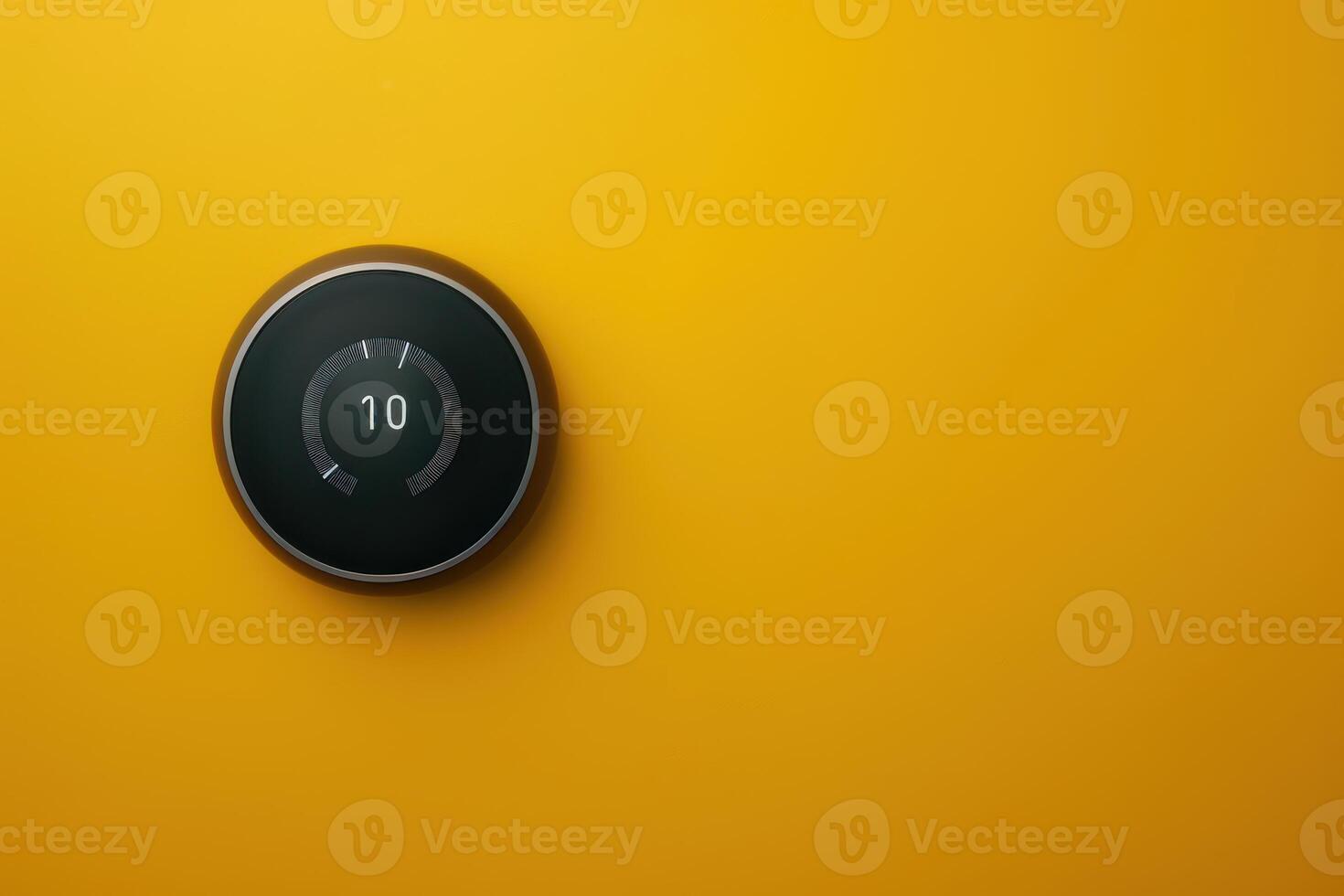 Modern smart thermostat on vibrant yellow wall displaying temperature settings photo
