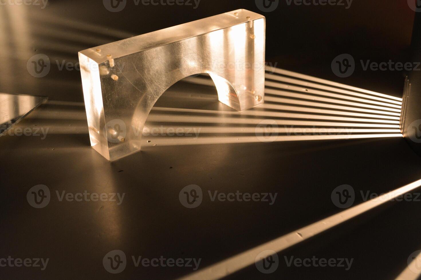 Rays of light are refracted on a black background. Background with a place for text in a stylish and modern concept for advertising phones, perfumes, appliances. photo