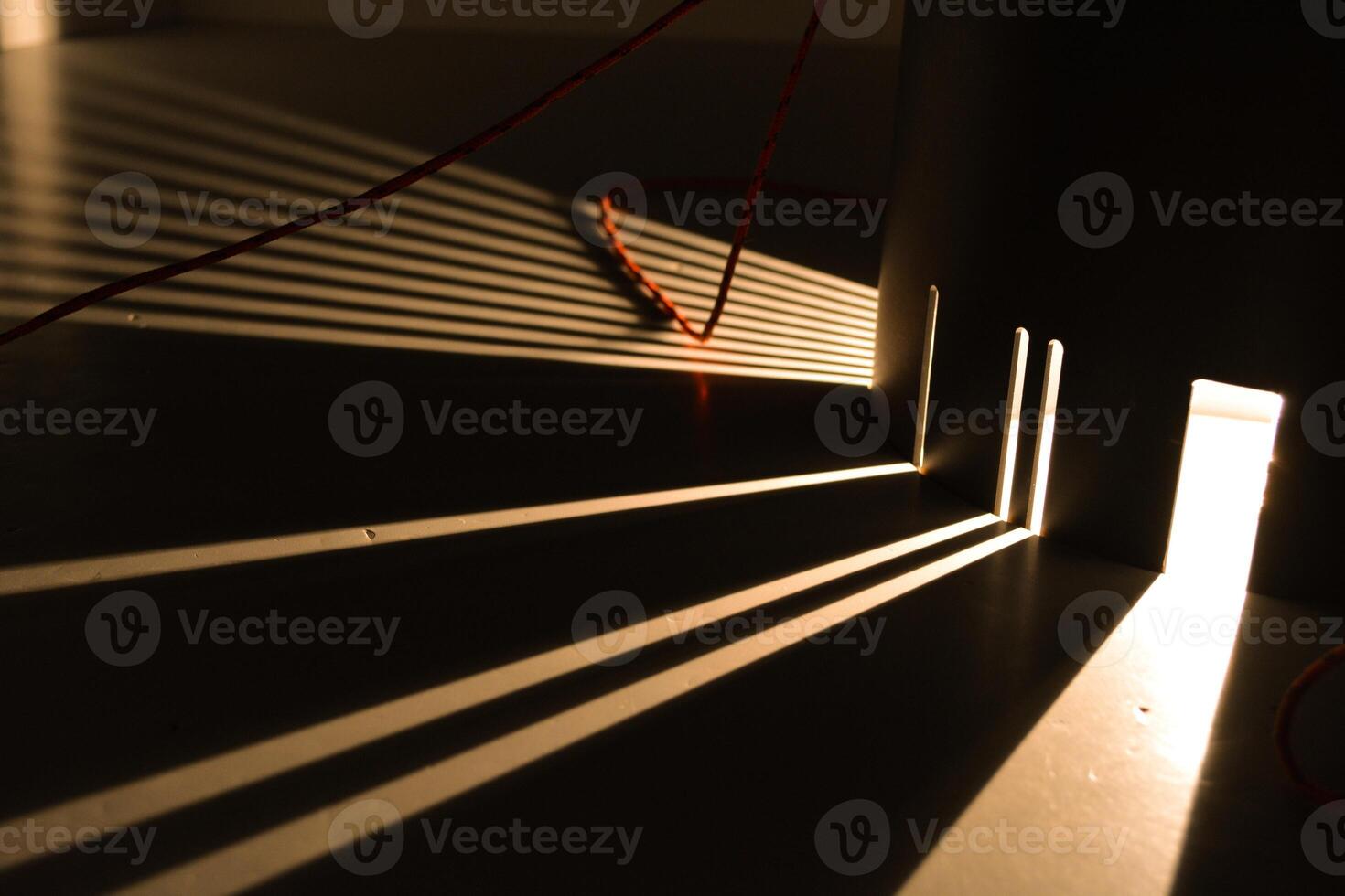 Rays of light are refracted on a black background. Background with a place for text in a stylish and modern concept for advertising phones, perfumes, appliances. photo