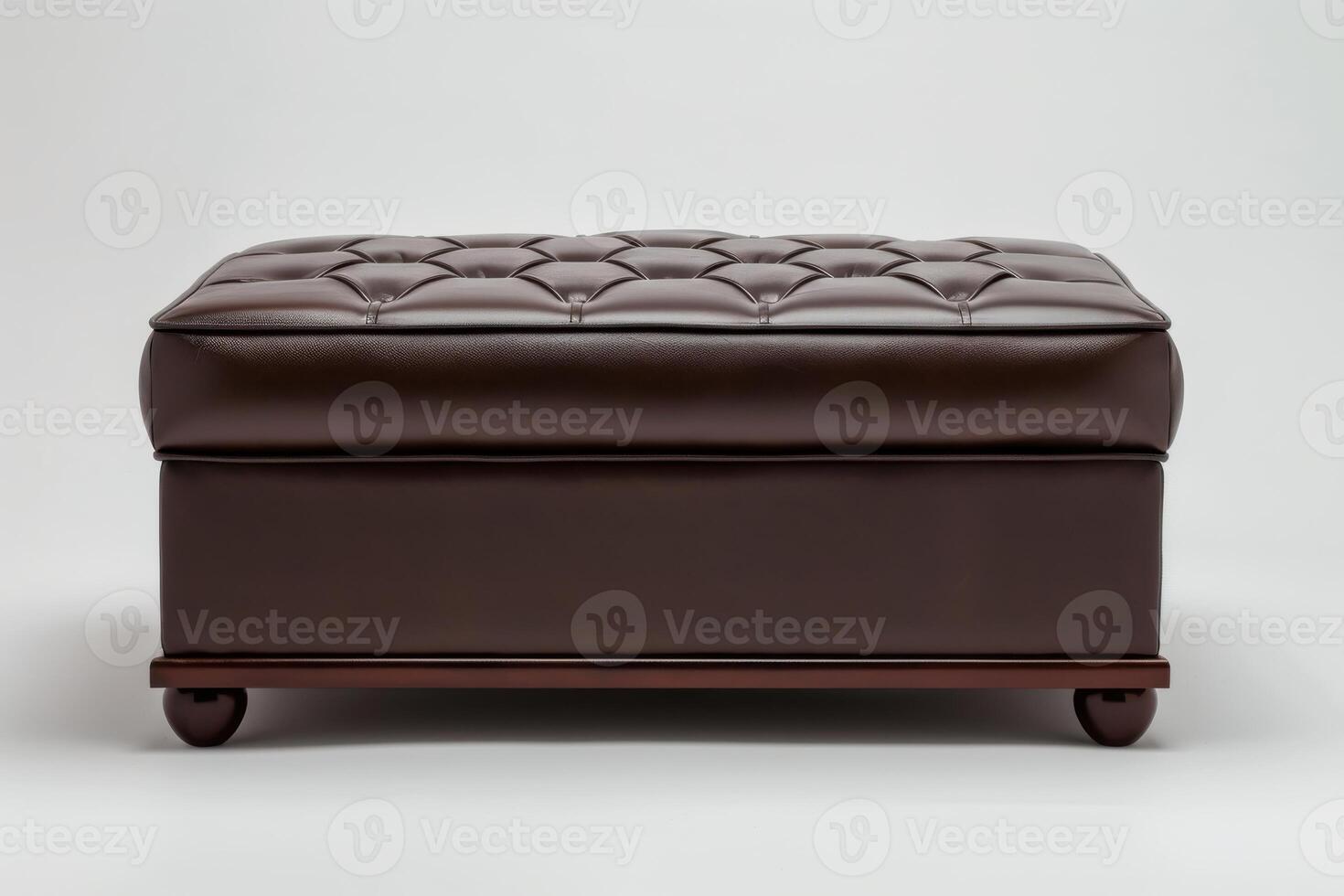 Elegant brown tufted ottoman on display against a neutral background photo
