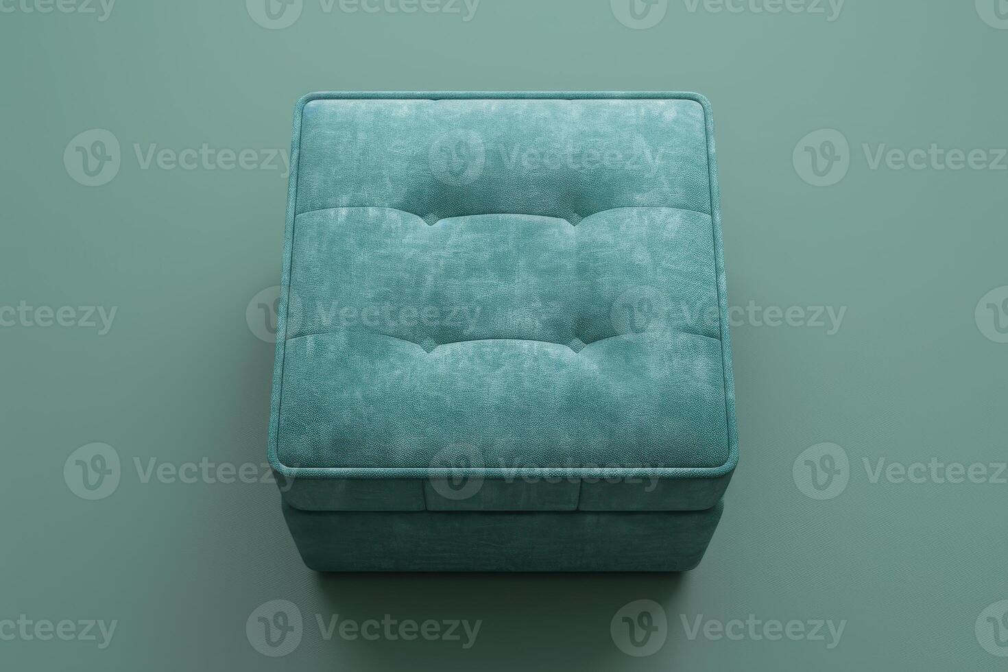 Soft teal ottoman with tufted design on a minimalist background photo