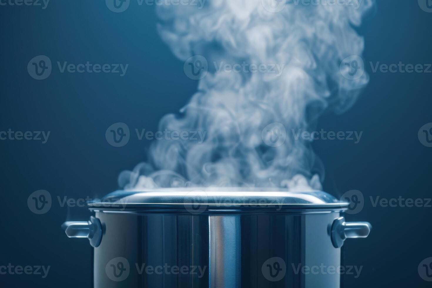 Steam rising from a metal pot on a blue background in a kitchen setting photo