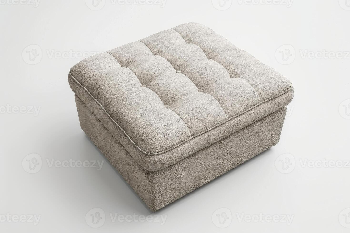 Soft gray upholstered storage ottoman with tufted design in bright interior setting photo