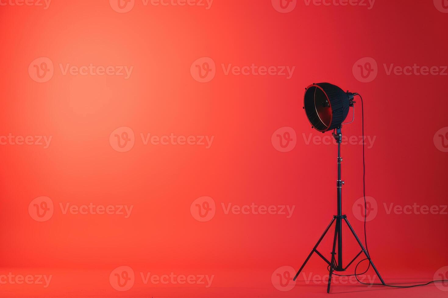 Studio lighting setup for a photoshoot against a bright red backdrop in the afternoon photo