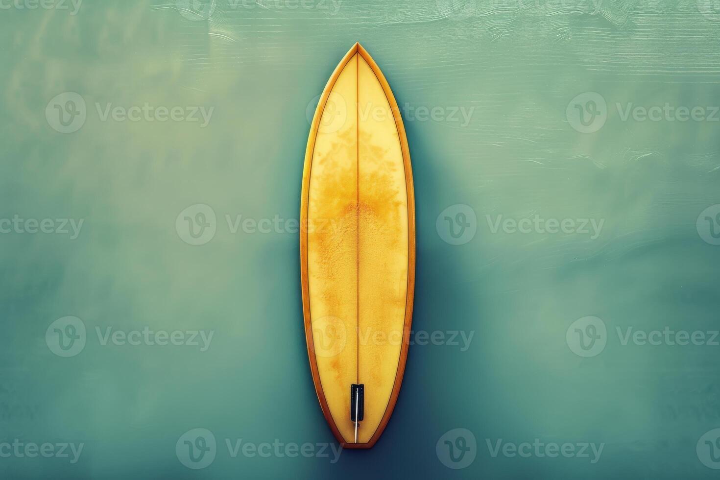 Surfboard resting on calm ocean water during a bright sunny day photo