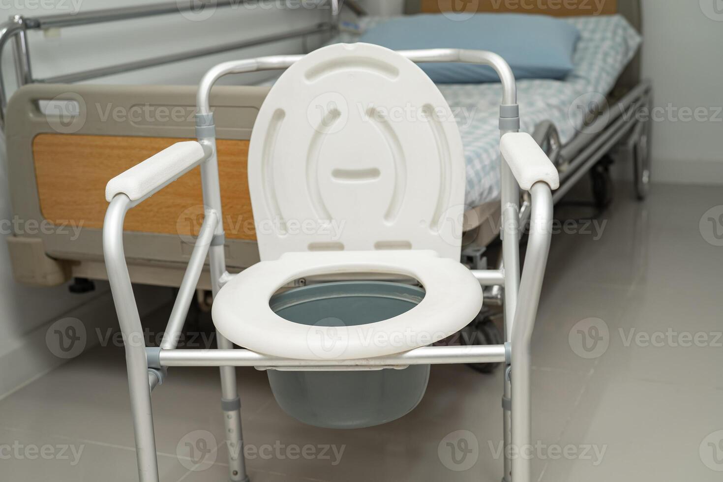 Flush toilet and shower chair in bathroom for old elder people. photo