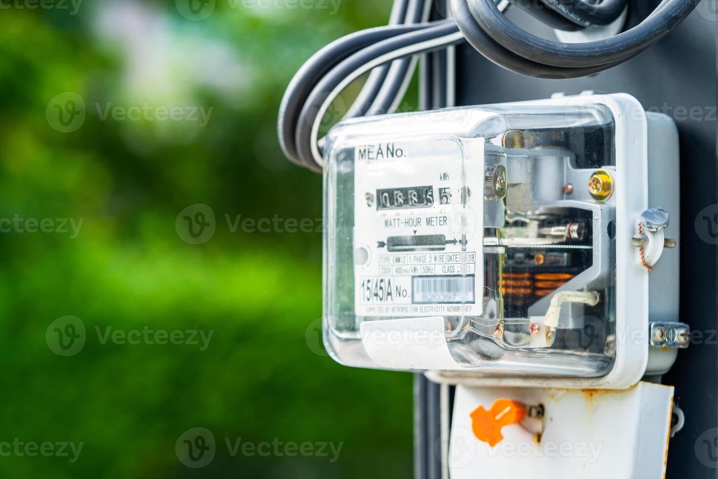 Electric measuring power meter for energy cost at home and office, solar cell concept. photo