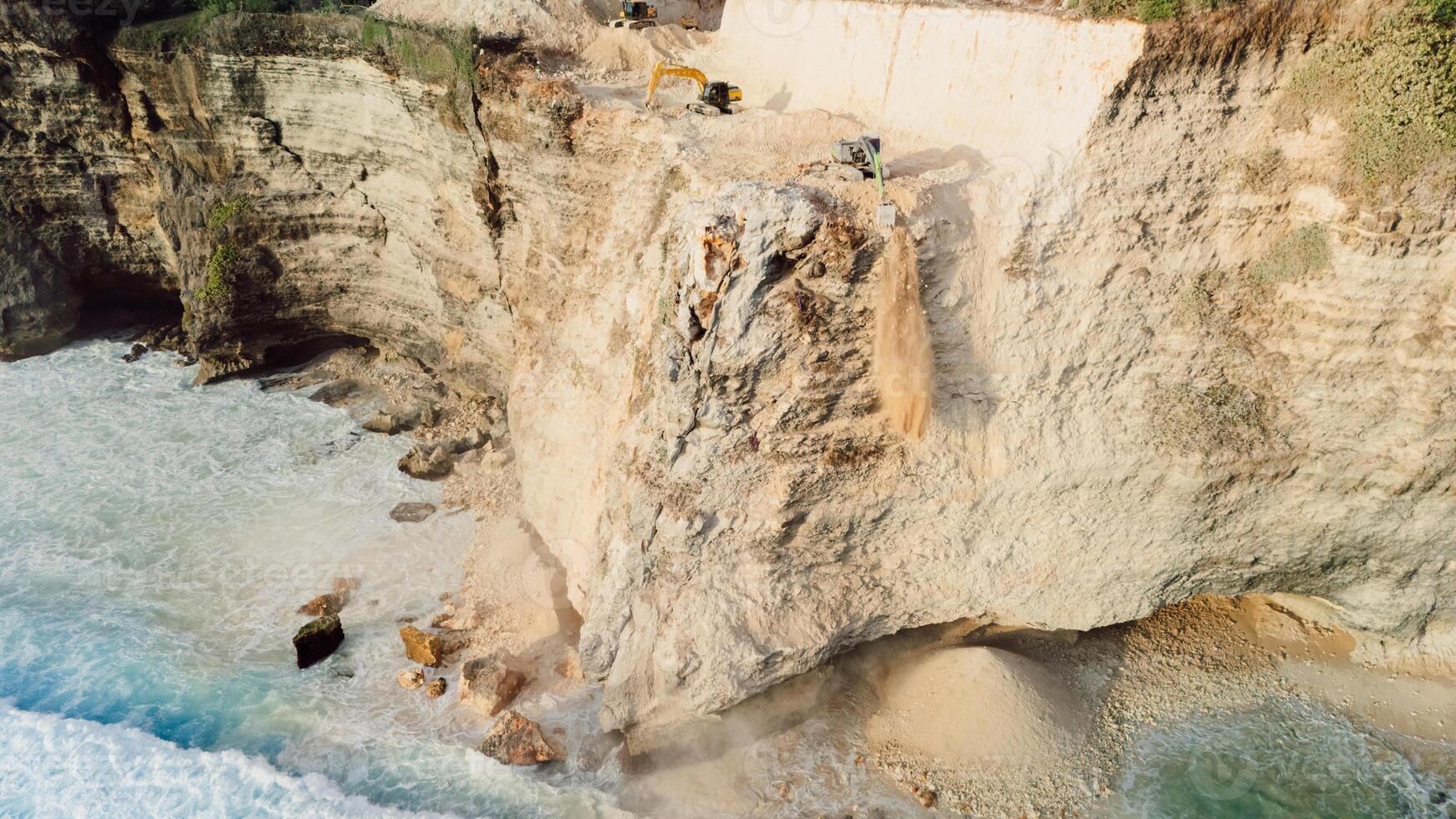Road construction in Uluwatu. The work of escalators destruction of the rock photo