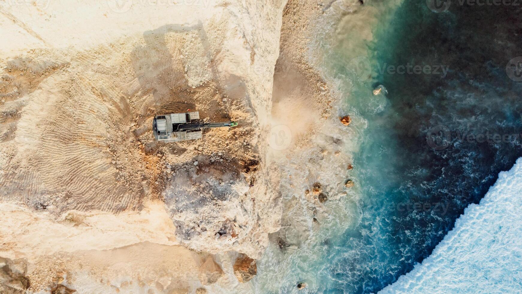 Escalators and the destroying of the cliff in Uluwatu, Bali. Aerial view, top down photo