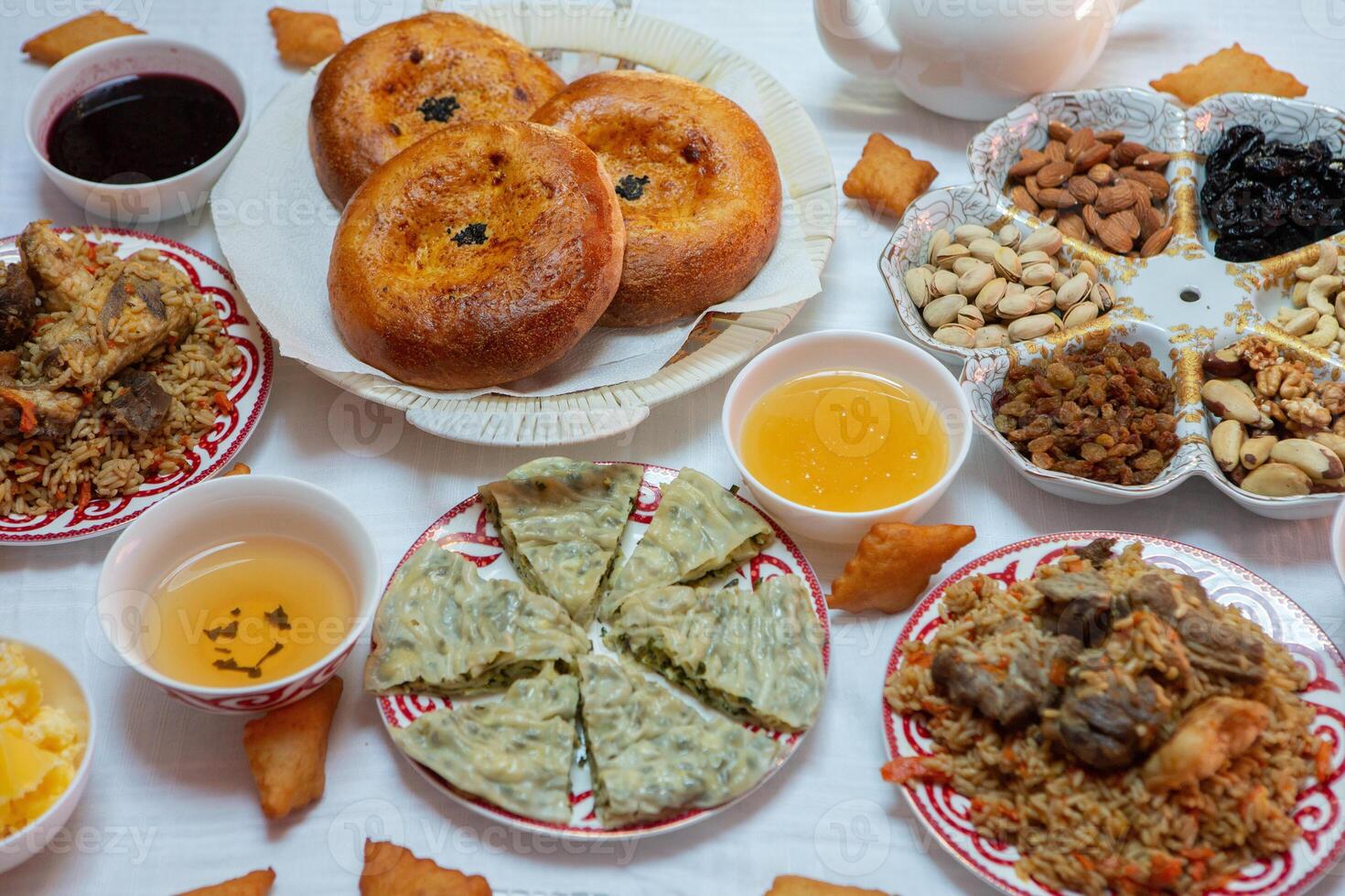 Meal with traditional Kyrgyz dishes served in the yurt. Local food in Kyrgyzstan. photo