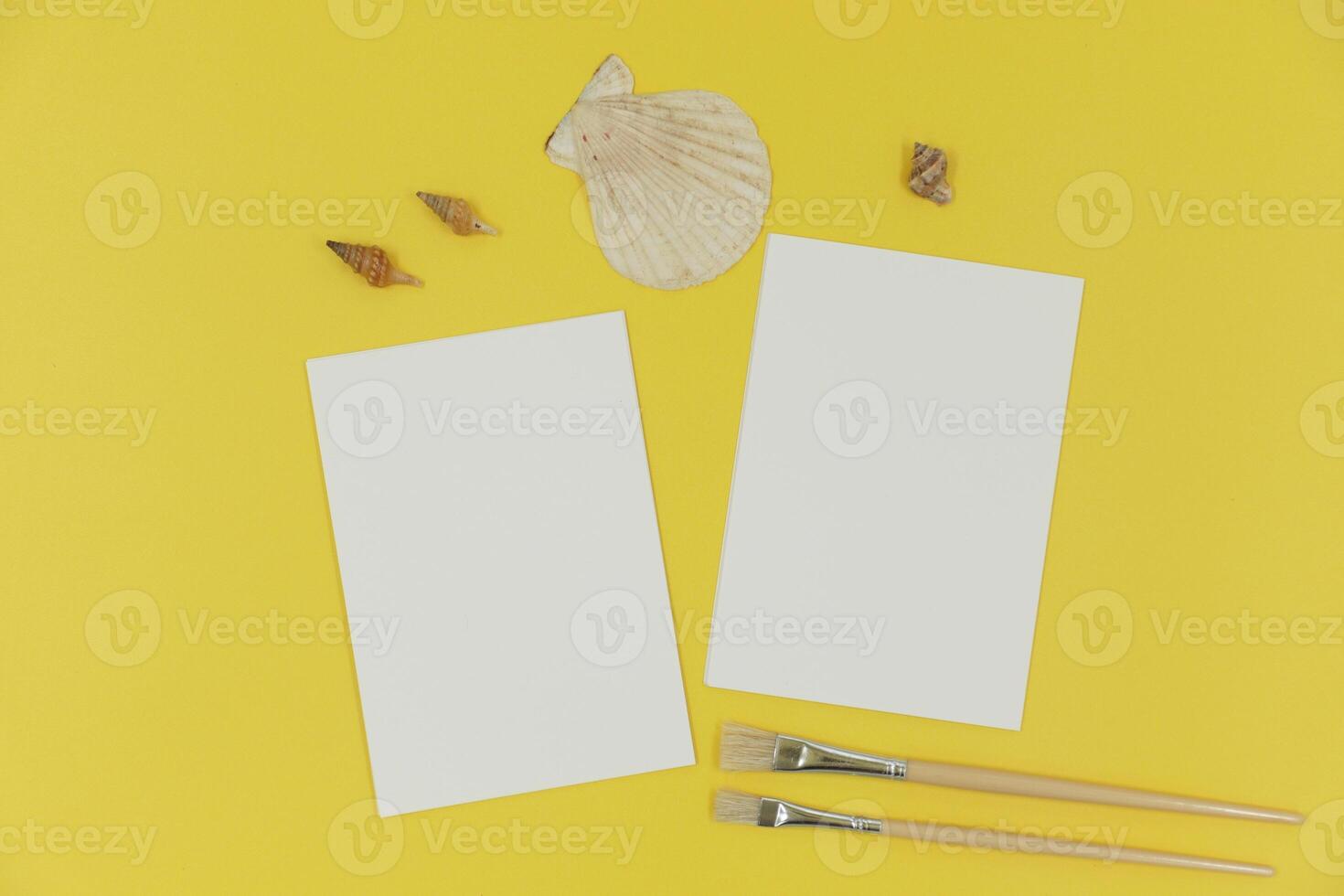 Blank paper mockup with brush and shells photo