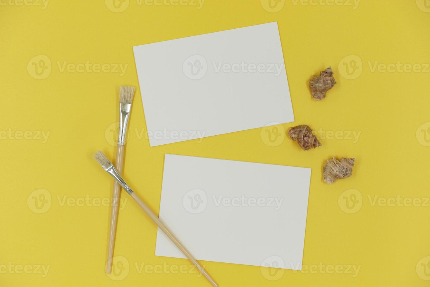 Blank paper mockup with brush and shells photo