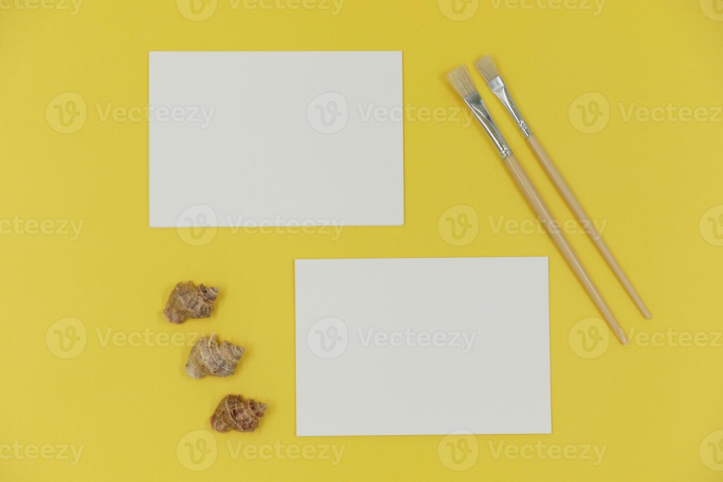 Blank paper mockup with brush and shells photo