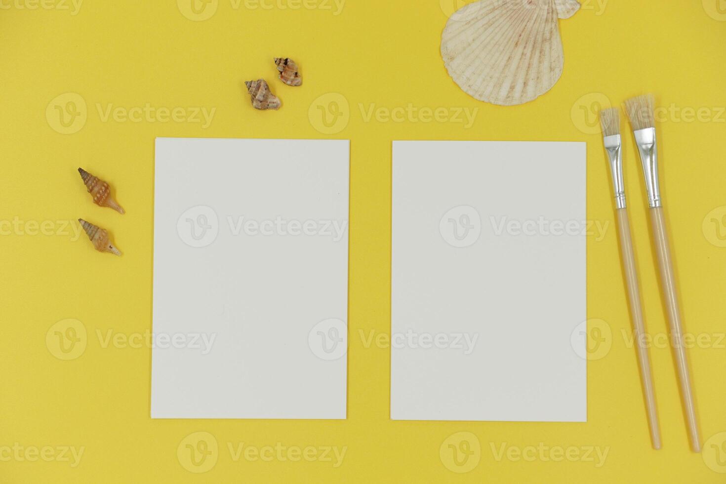 Blank paper mockup with brush and shells photo