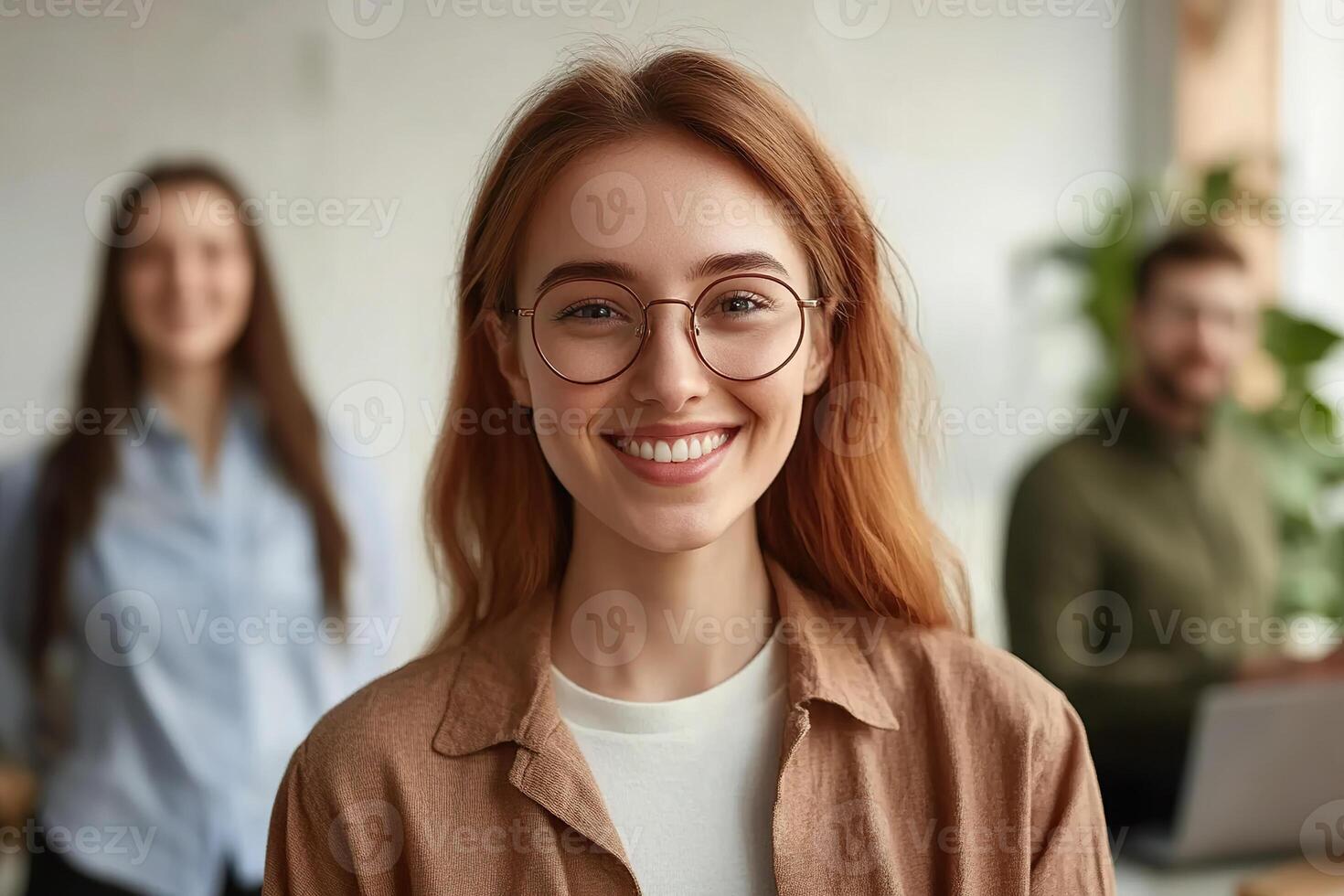 Office workers smiling and engaging positively while collaborating together photo