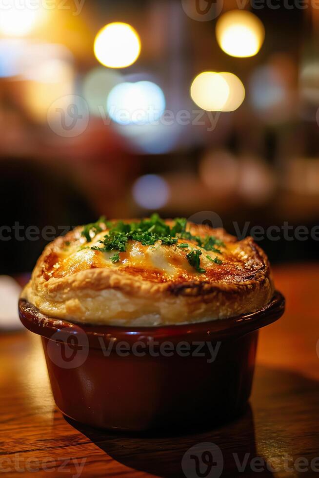 Delicious chicken pot pie with fluffy crust and herbs on wooden table in cozy setting. photo