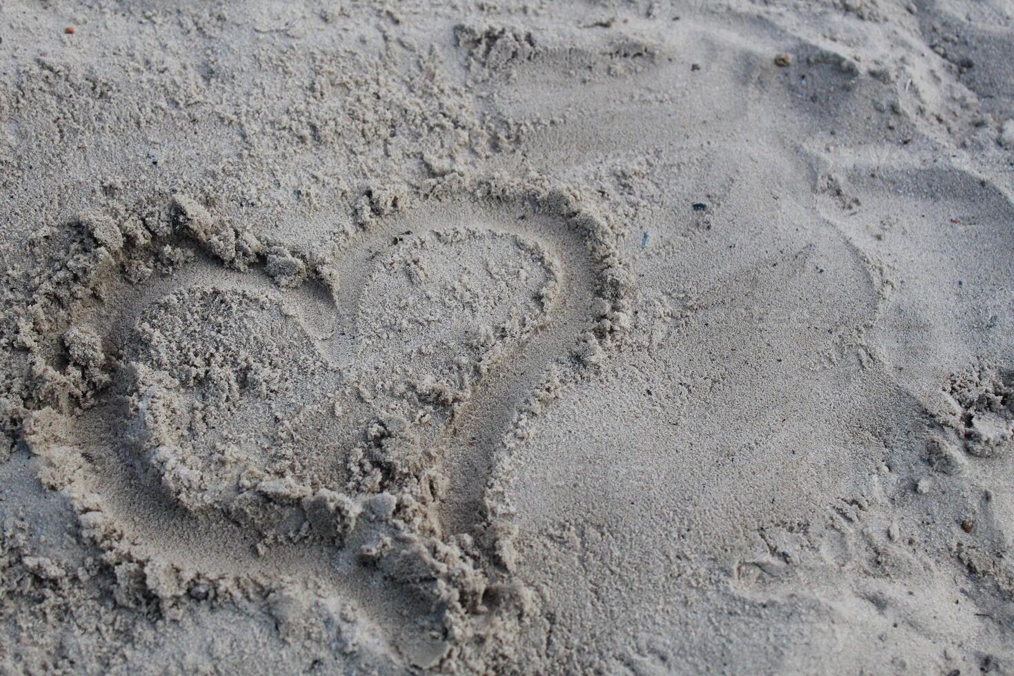 Character heart painted on the sand of Valentine's Day prazdink on open-piece copyspace photo