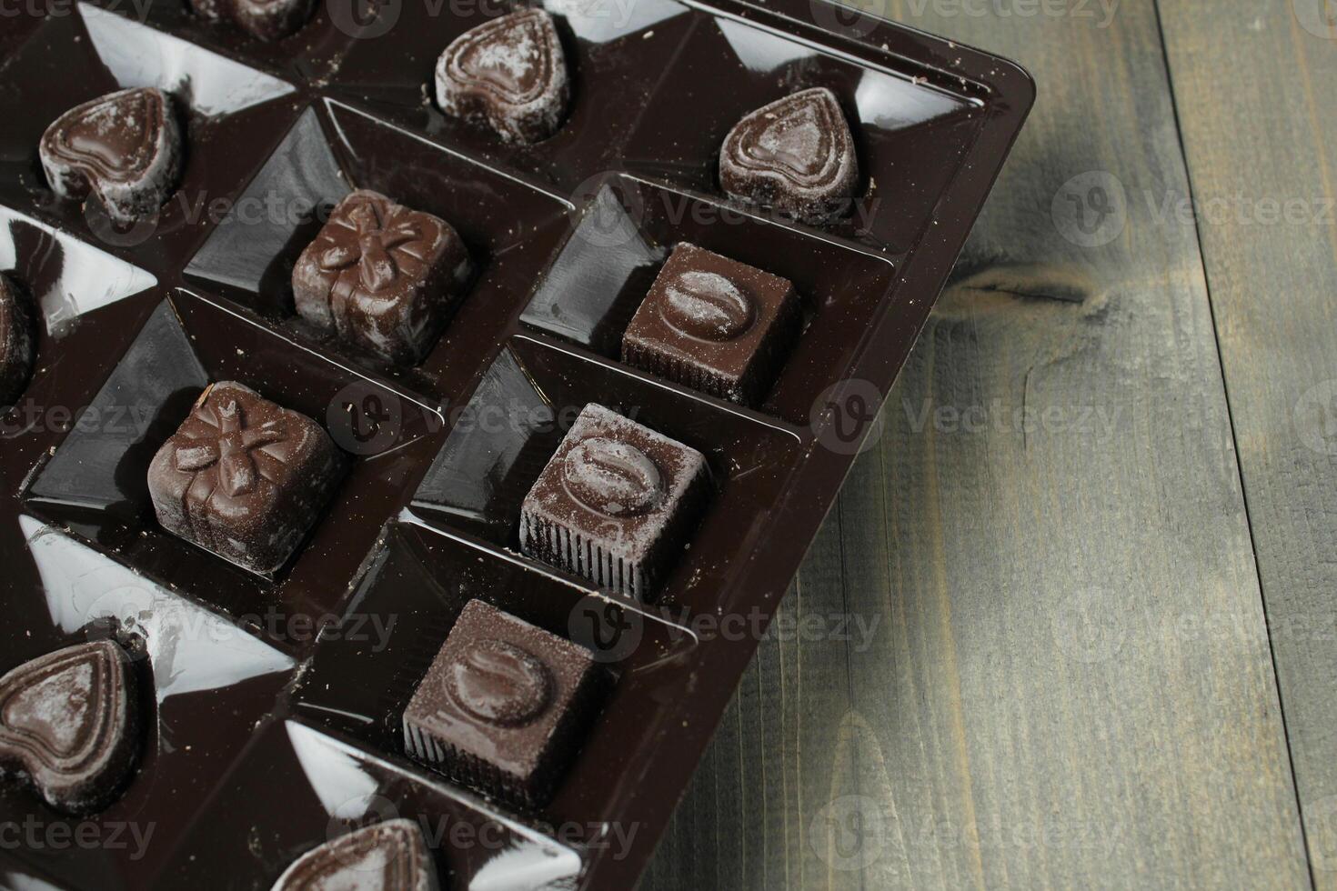 Chocolates in a box of correx on a rum background. Candy Storage Holiday Gift photo