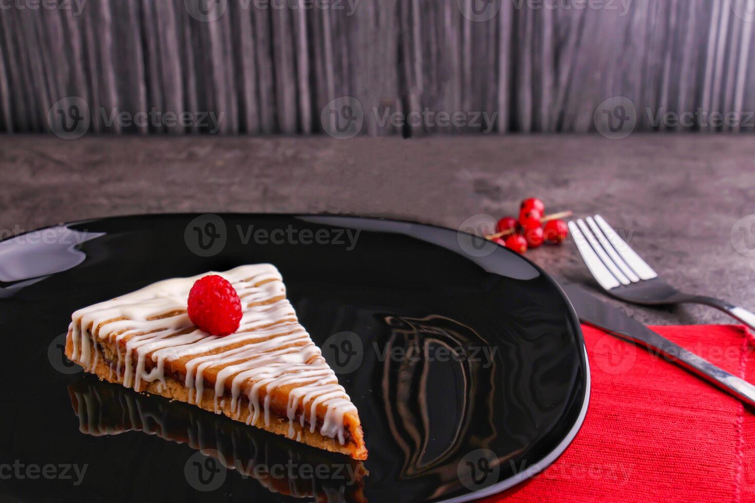 Raspberry Tart with White Chocolate Drizzle Cookie Cake slice served in plate isolated on table side view of indulgent dessert photo