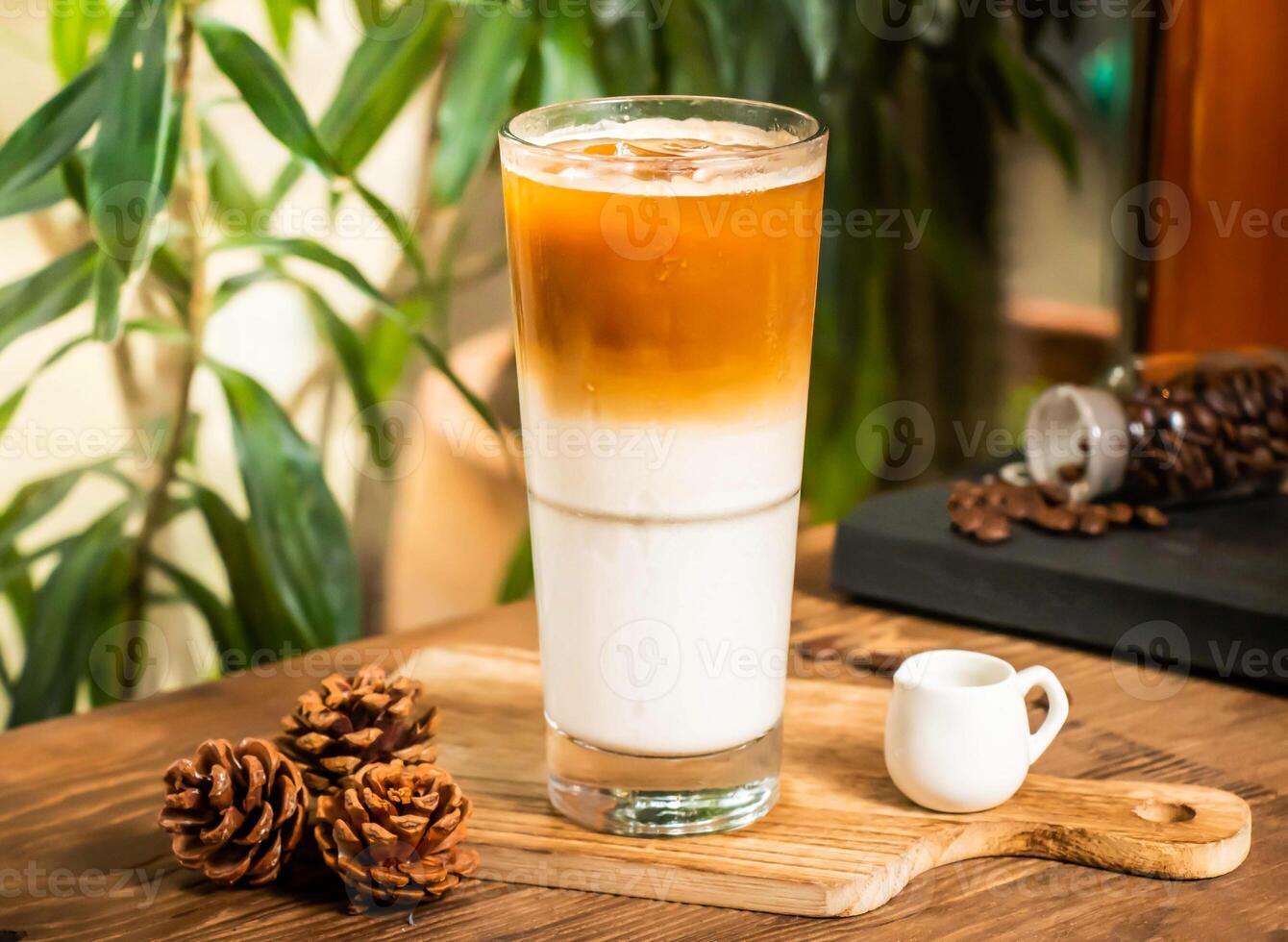 Iced Latte served in glass isolated on table side view of taiwan drink photo