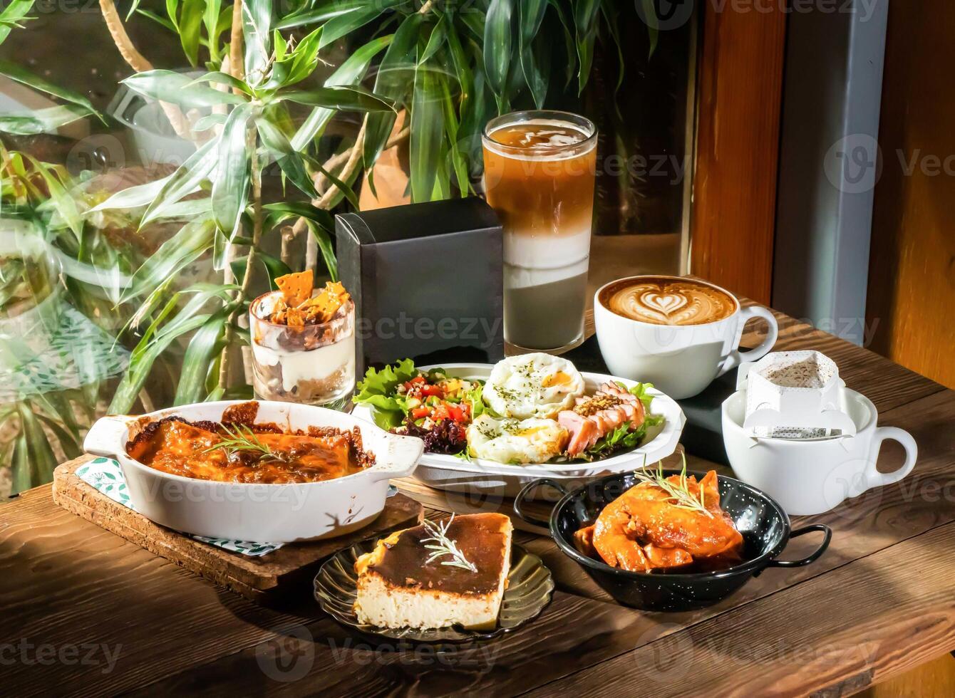 Diverse Cafe Menu Bolognese Lasagna, Salad Box Smoked Duck Breast Salad, Spicy Buffalo Chicken Wings, Basque cheesecake, Iced Latte, Tiramisu, Coffee Filter Pack photo