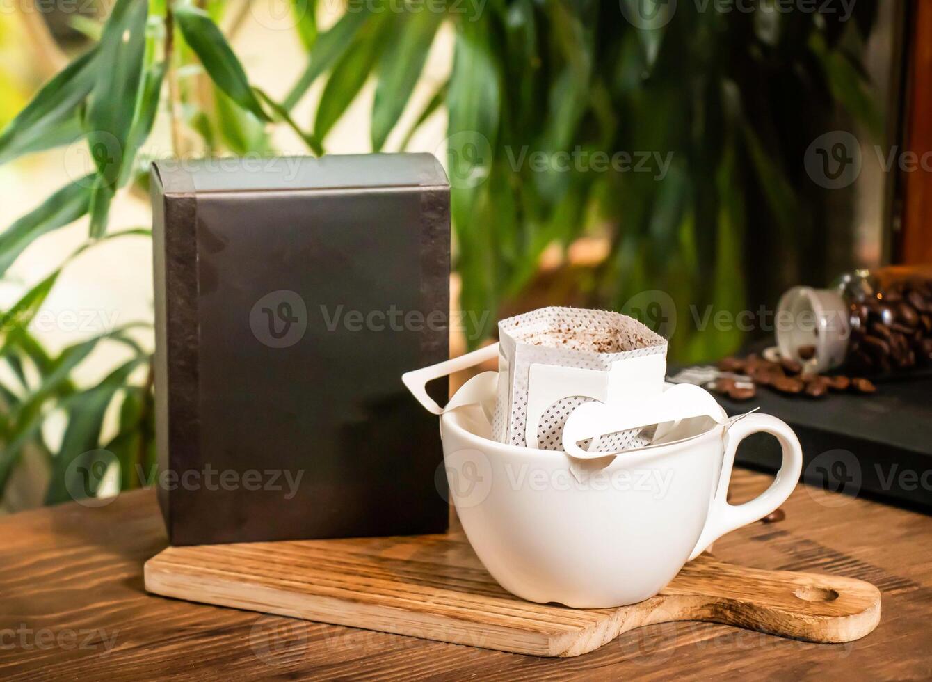 Single Serve Coffee Filter Pack served in box and cup isolated on table side view of taiwan drink photo