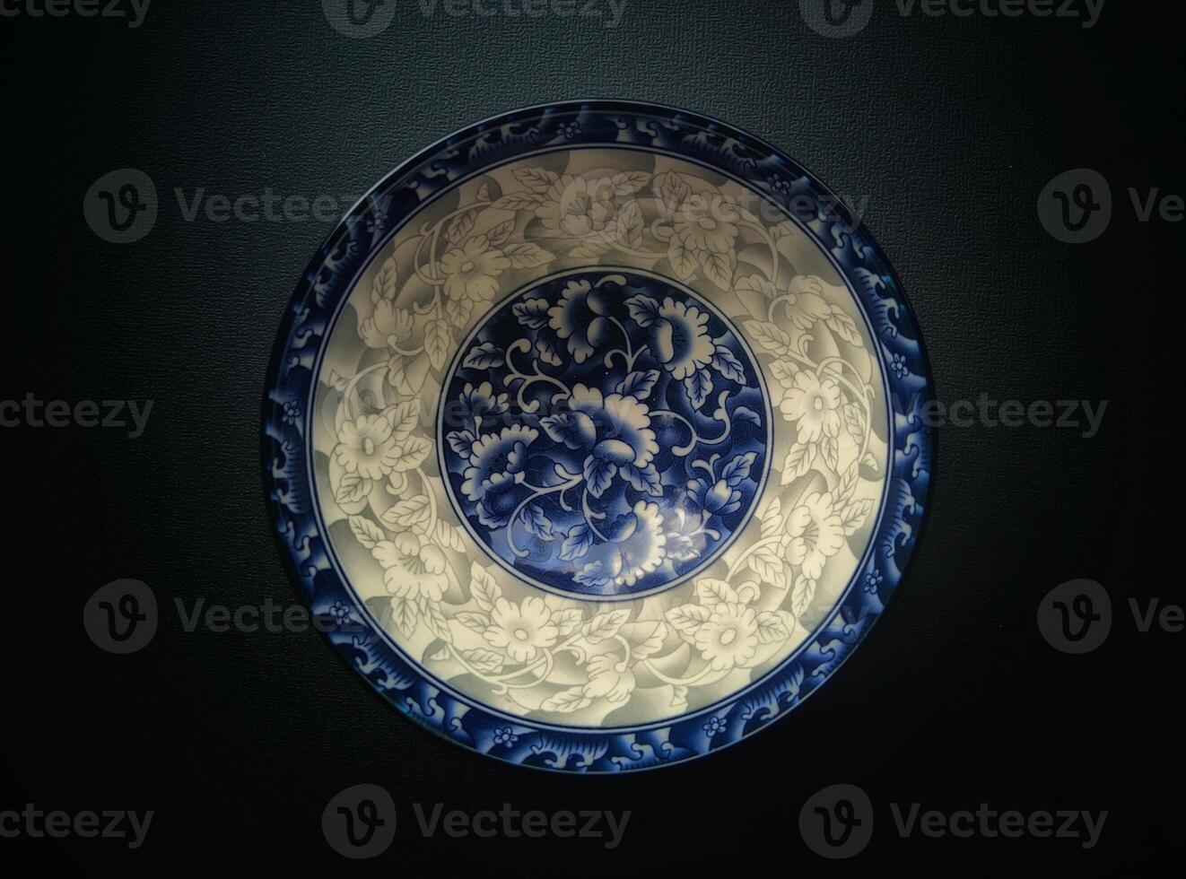 A blue and white plate with a design on it photo