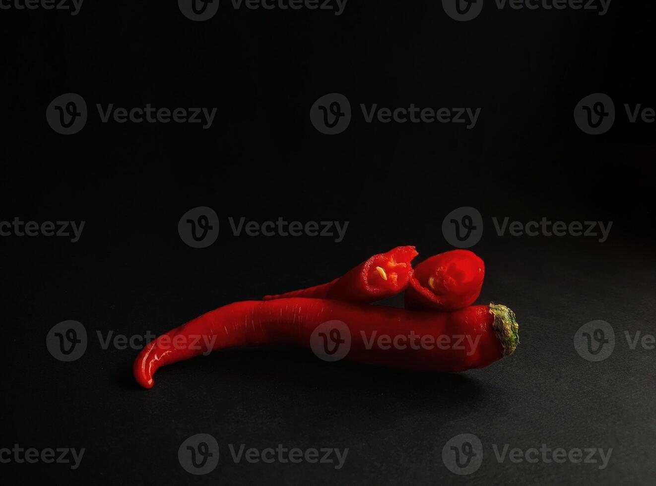 A red pepper on a black background photo