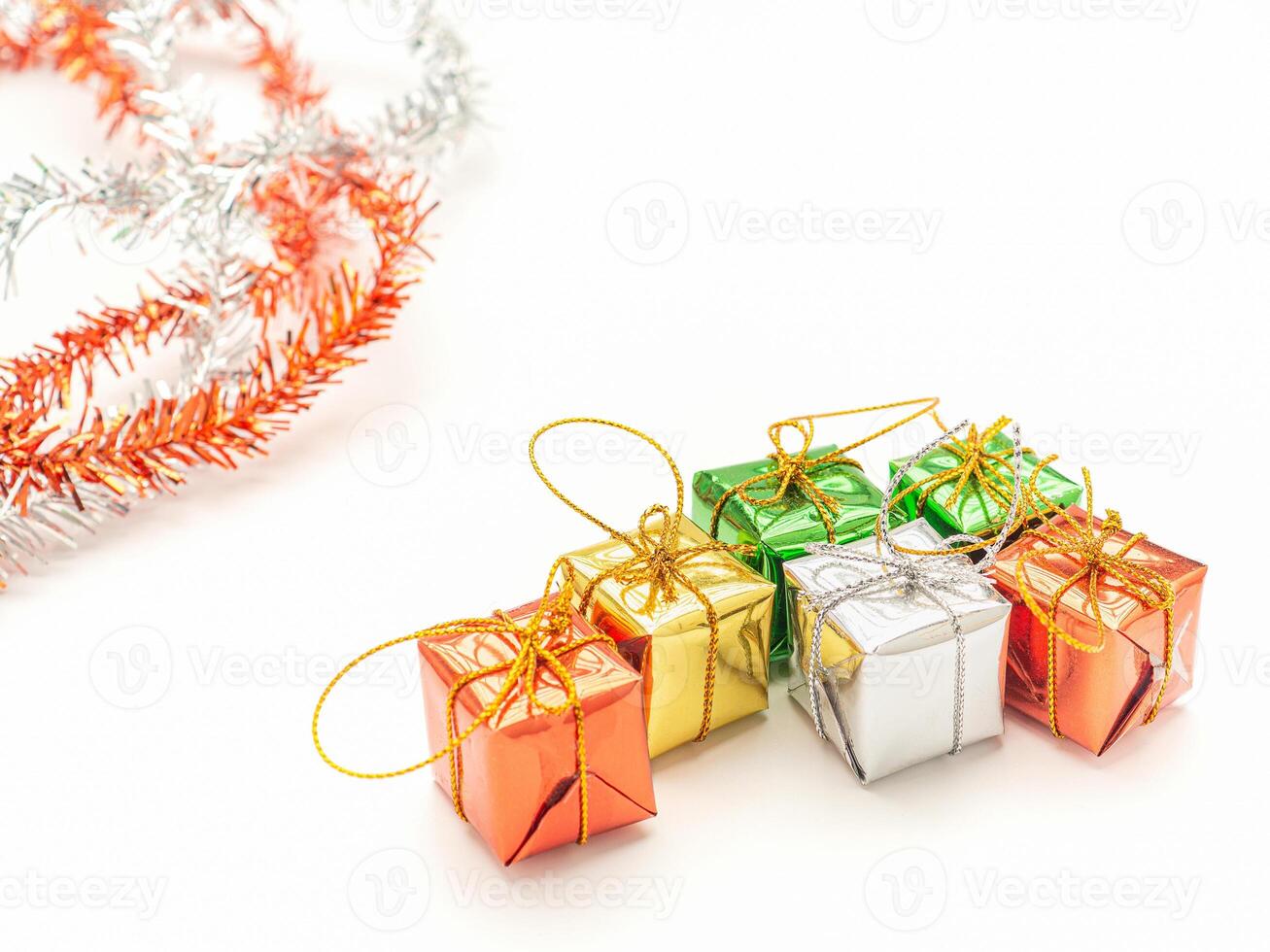 Part of Christmas tree and colorful gift boxes isolated on white background. Space for text. Top view. Flat lay. Christmas and Happy New Year concept photo