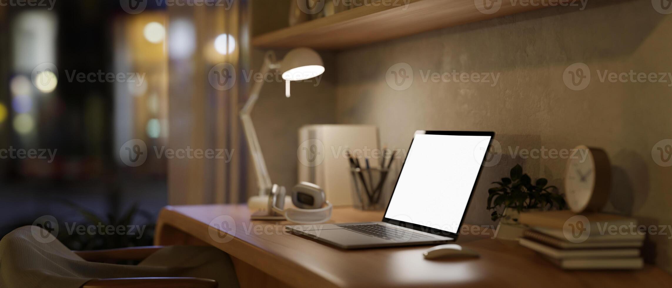 A minimal Scandinavian beige home office workspace at night with a laptop on a wooden table. photo