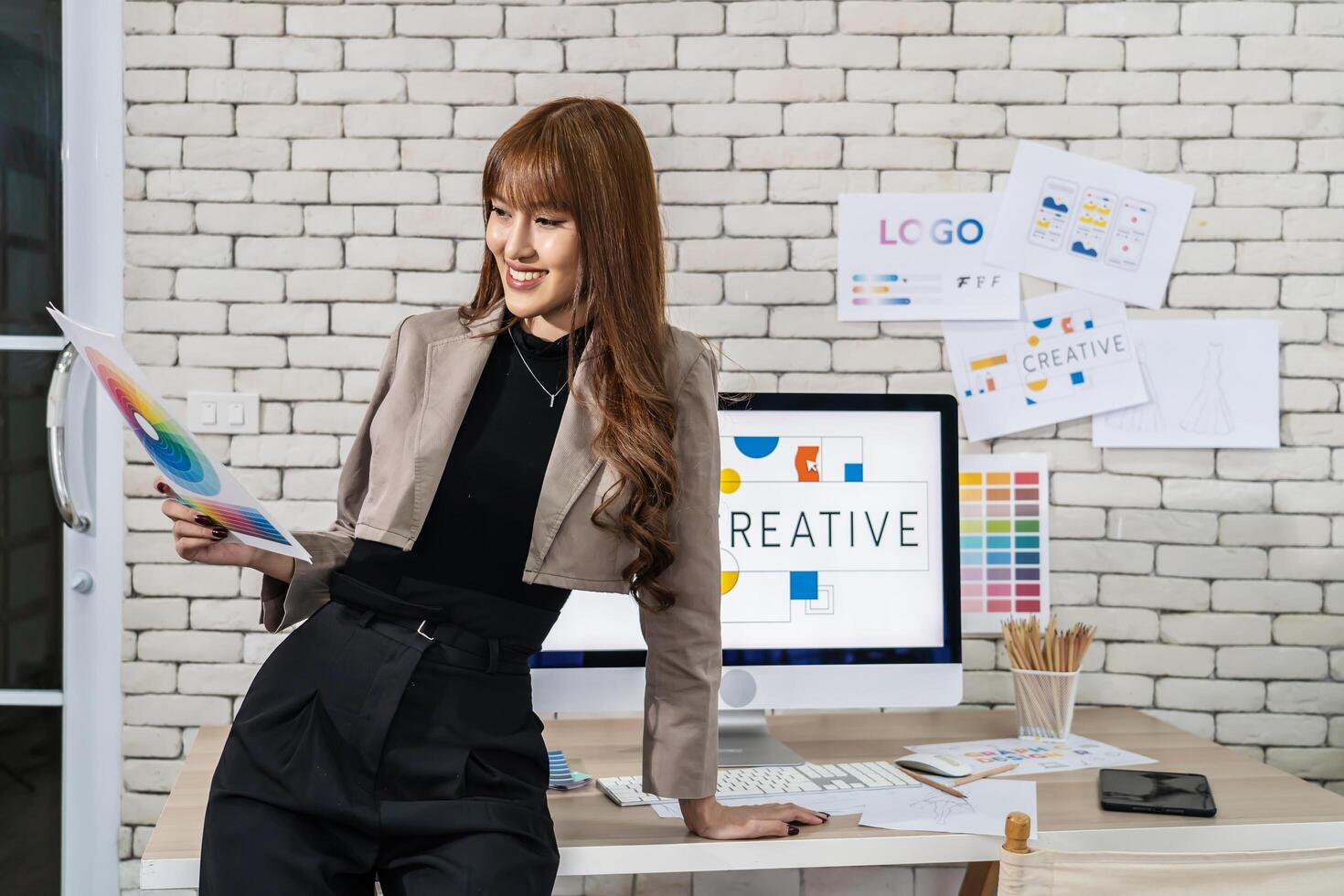 Young asian woman graphic designer working in office. Artist Creative Designer Illustrator Graphic Concept, corporate women in creative marketing team working on project management photo