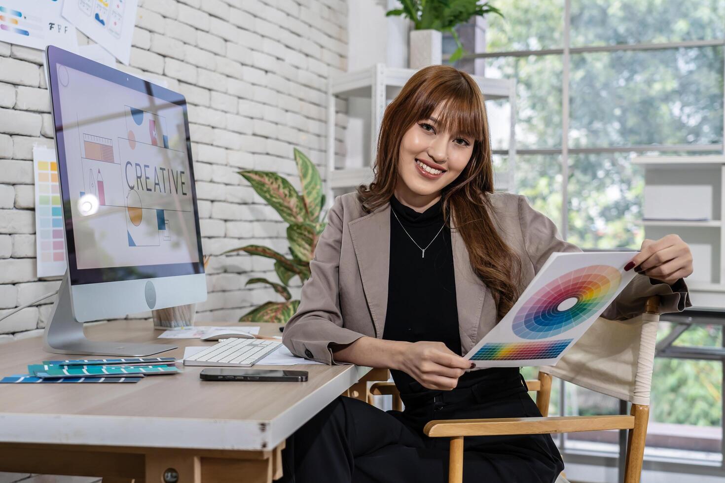 Young asian woman graphic designer working in office. Artist Creative Designer Illustrator Graphic Skill Concept, corporate women in creative marketing team working on project management, thinking photo