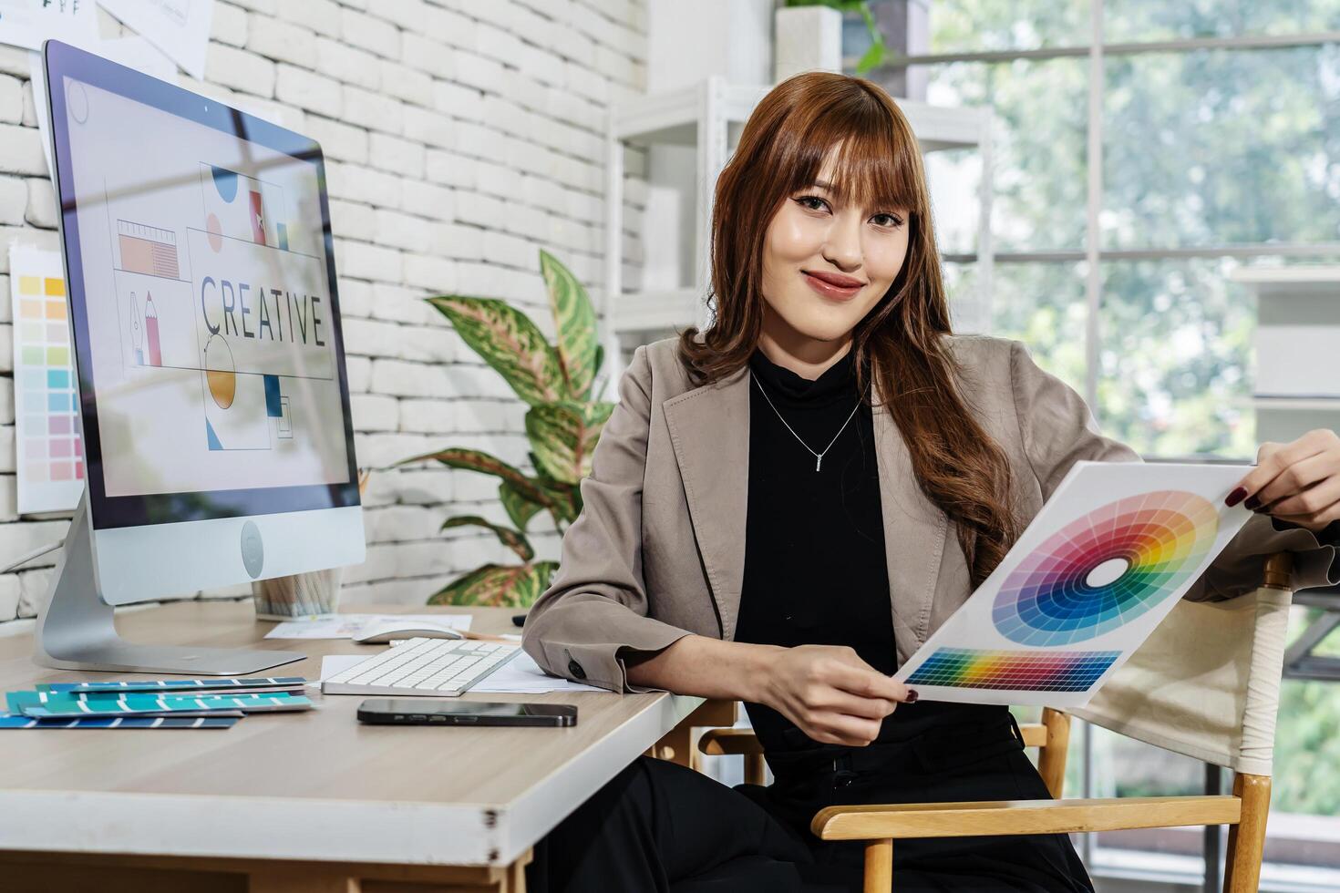 Young asian woman graphic designer working in office. Artist Creative Designer Illustrator Graphic Skill Concept, corporate women in creative marketing team working on project management, thinking photo