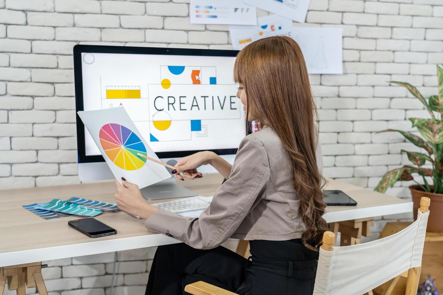 Young asian woman graphic designer working in office. Artist Creative Designer Illustrator Graphic Skill Concept, corporate women in creative marketing team working on project management, thinking photo