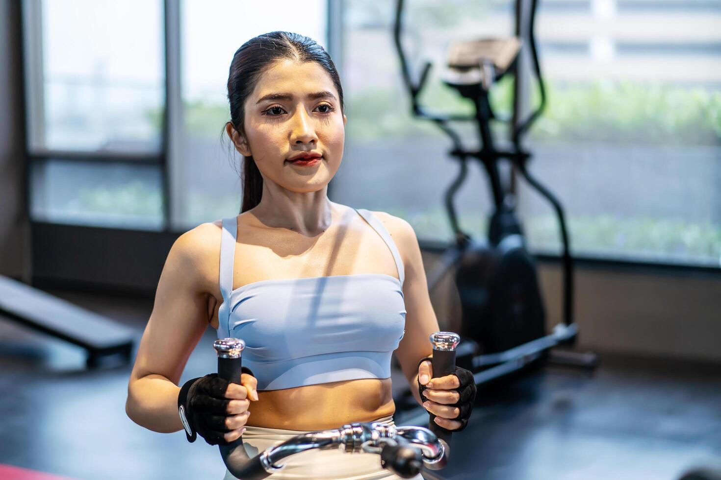 Front view of Asian women doing exercises in fitness, exercises to - Best Fat Burning Pre Workout For Females
