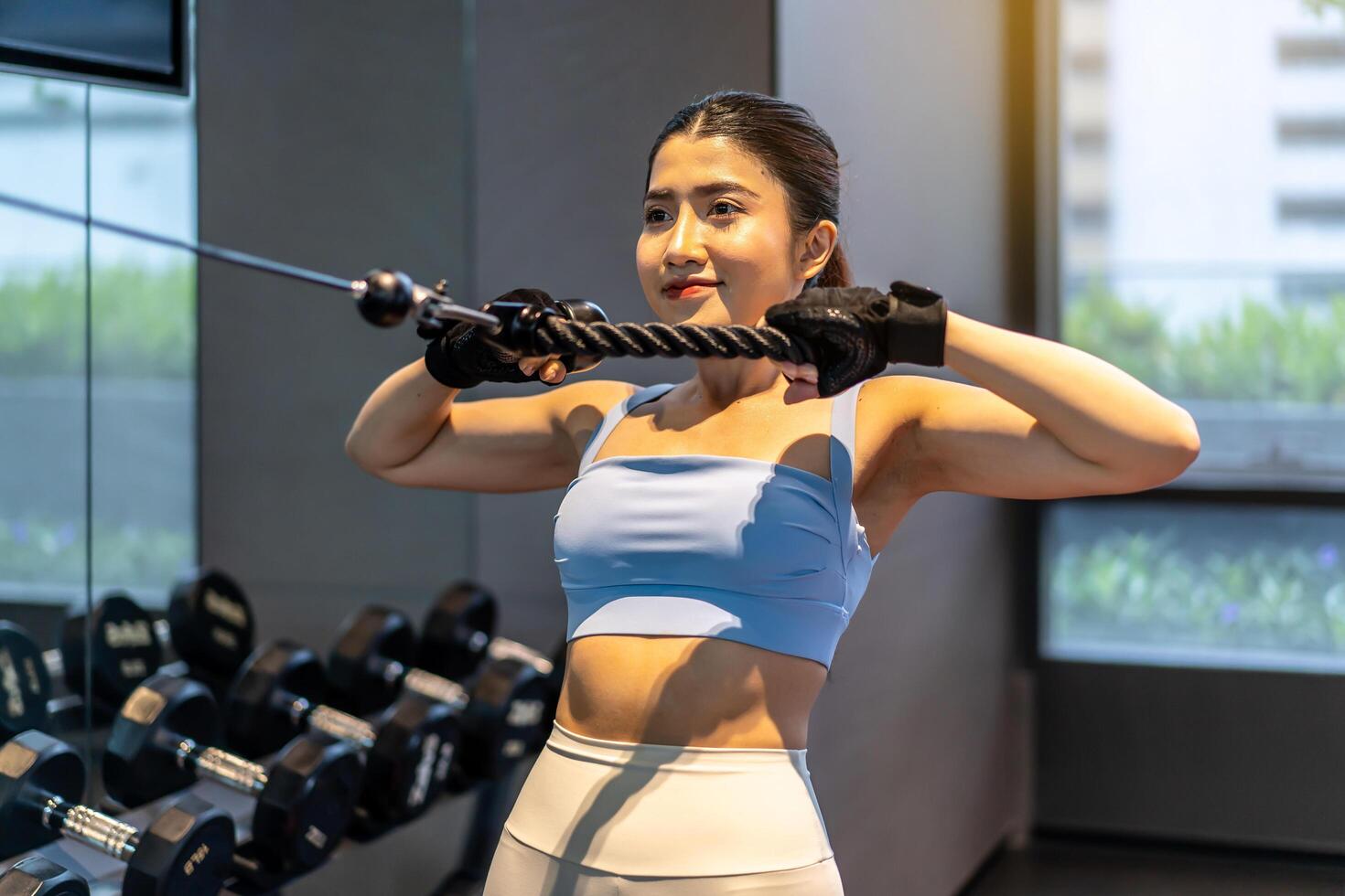 Asian women doing exercises in fitness, exercises to strengthen muscles and strength, lose body fat burning, pre-workout warm-up, Concept of health care women. photo