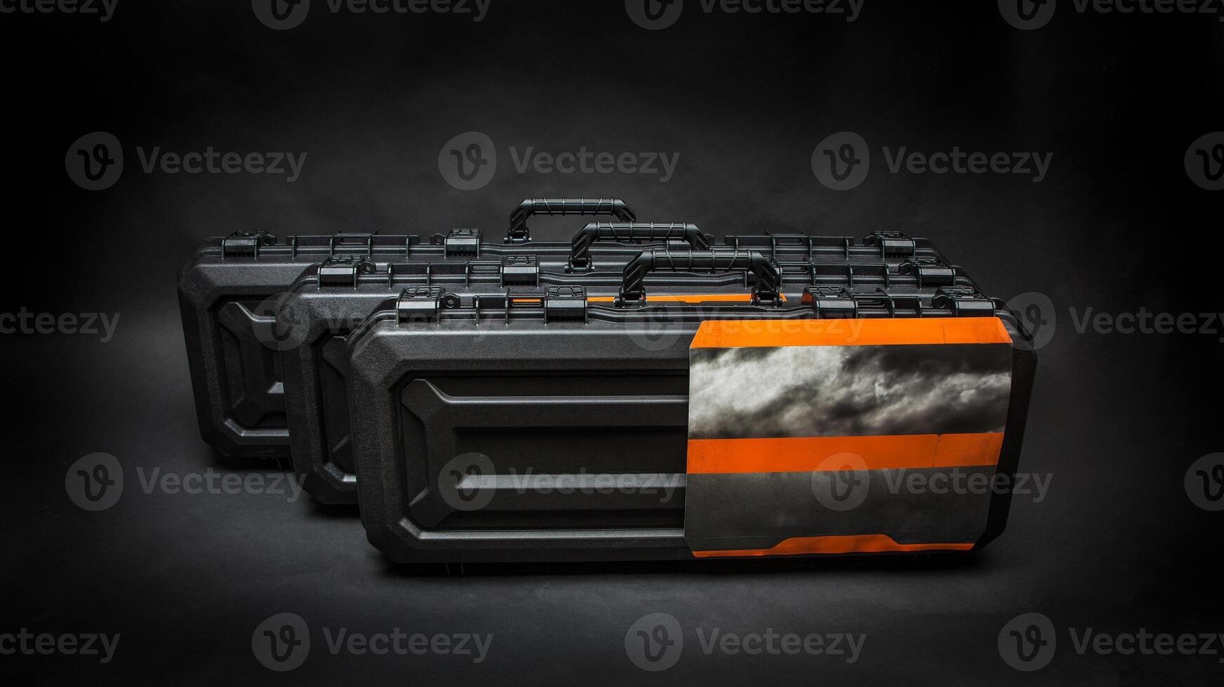 Black plastic container with foam inside for safe storage and transportation of fragile and expensive items. Sturdy plastic case. Dark back photo