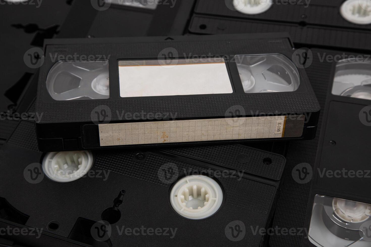 Videotape with blank tags. Pile of VHS cassettes. Vintage media. Isolate on a white back photo