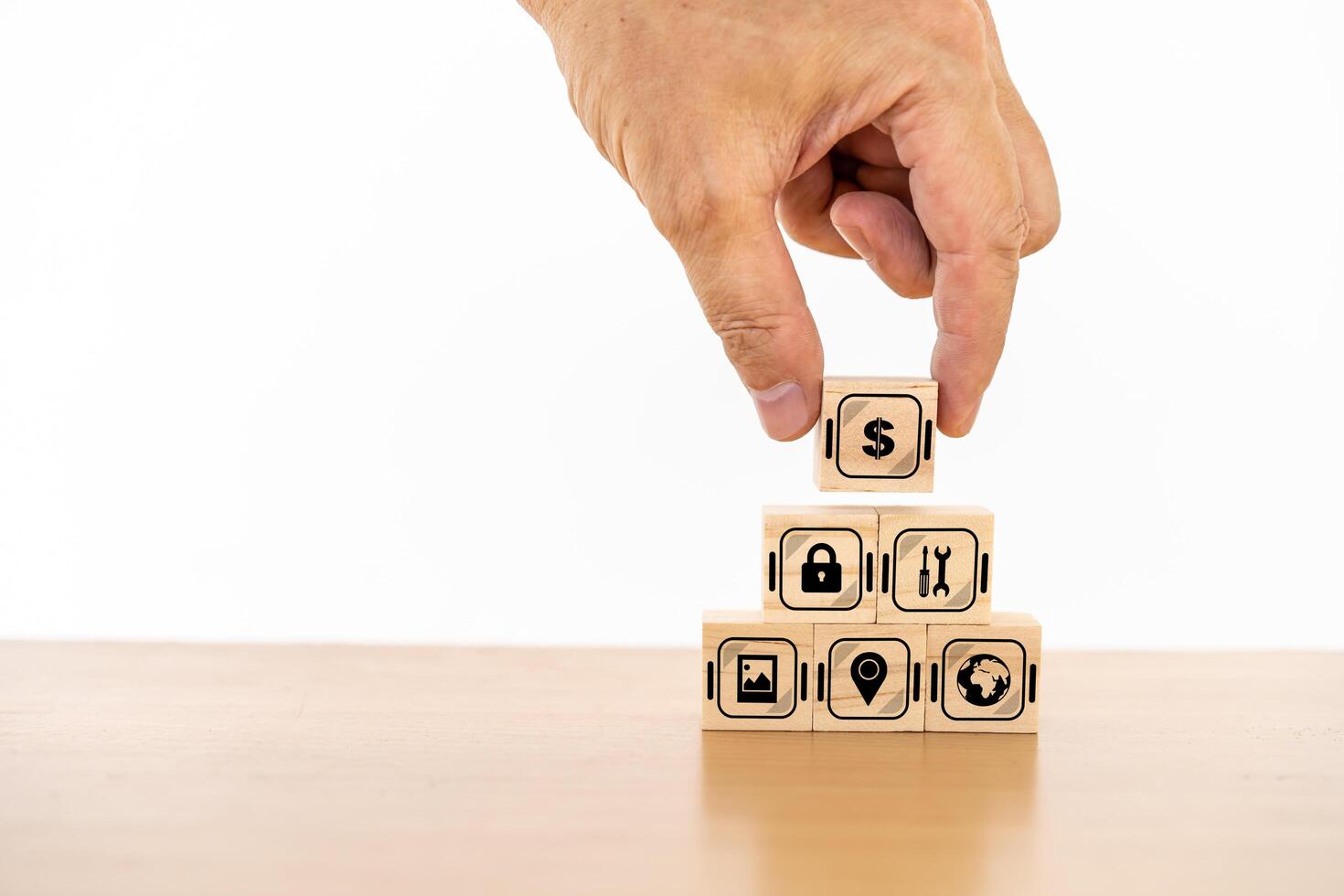 Businessman with wood cube block and icon symbol to success concept. Strategy to get more money per oder. training and compliance. Industrial safety banner. photo