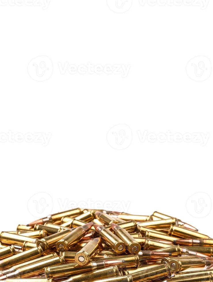 cartridges for 308 caliber rifle on a white background. a bunch of ammo. cartridges scattered on a light background photo