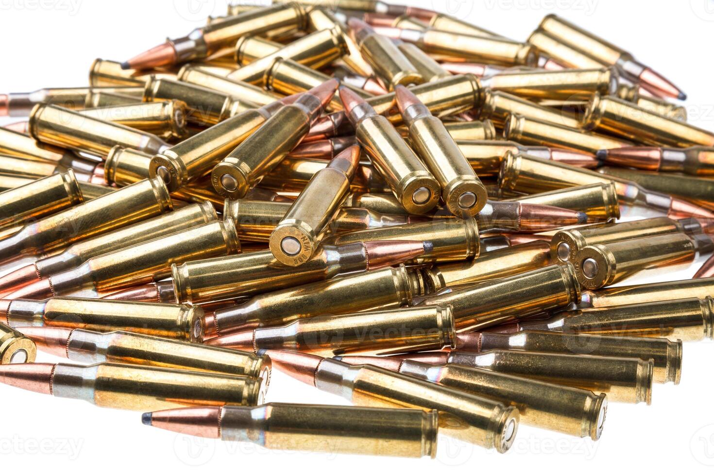 cartridges for 308 caliber rifle on a white background. a bunch of ammo. cartridges scattered on a light background photo