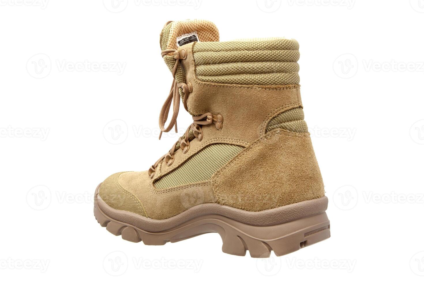 Modern army combat boots. New desert beige shoes. Isolate on a white back. photo