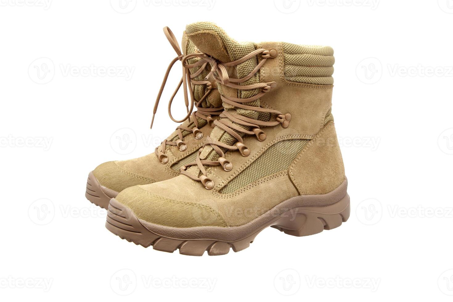 Modern army combat boots. New desert beige shoes. Isolate on a white back. photo