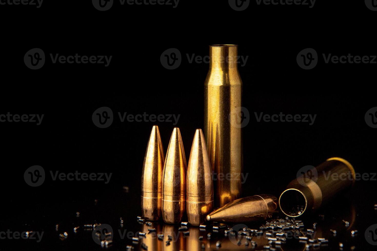 Bullet isolated on black background with reflexion. Rifle bullets close-up on black back. Cartridges for rifle and carbine on a black. photo